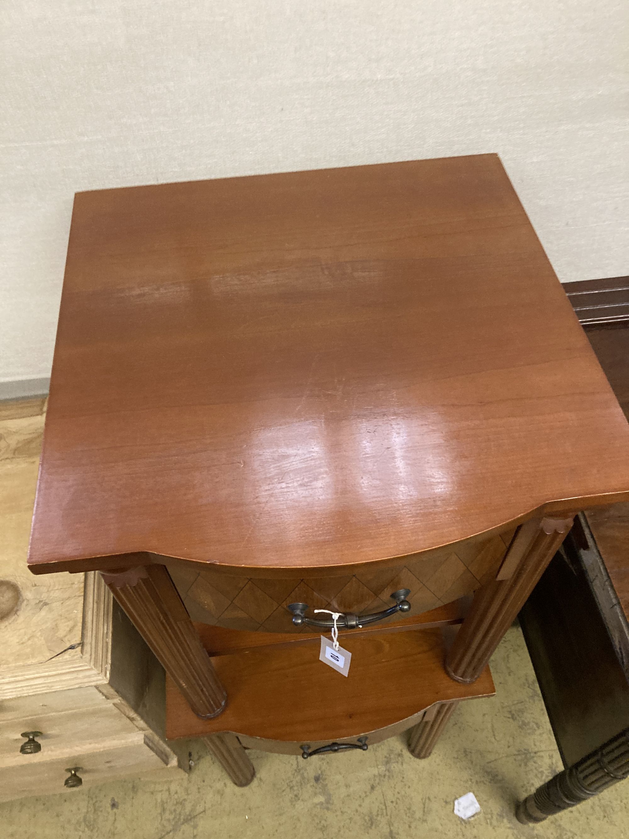 A pair of mahogany bow front bedside tables, width 50cm, depth 50cm, height 62cm